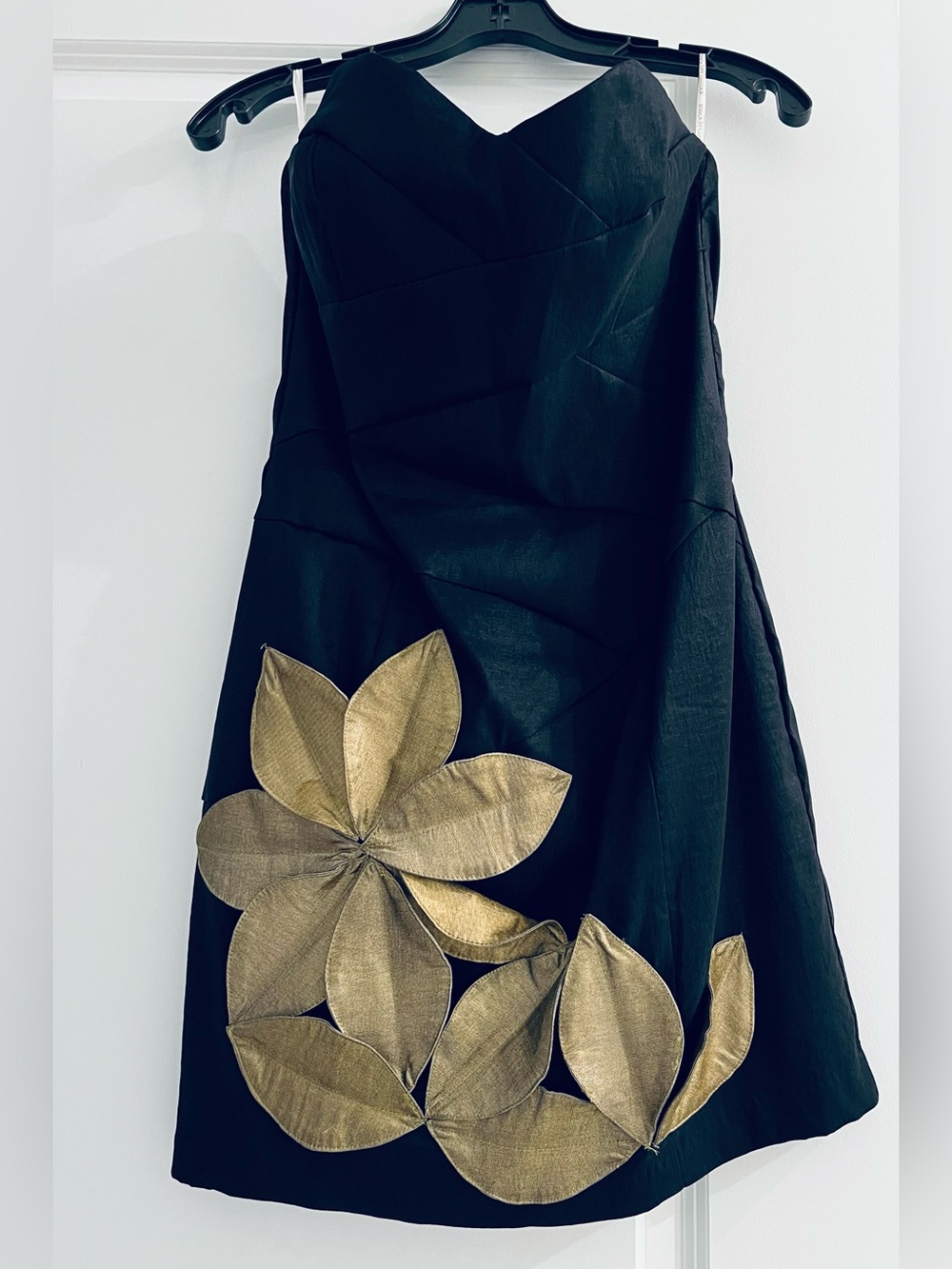 Jessica McClintock Black mini dress featuring elegant gold-tone appliqué